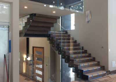 Glass panel railing installation by Johnson Iron, Truckee CA